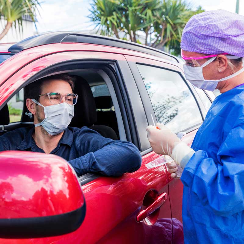 Man being tested at drive-thru COVID collection site